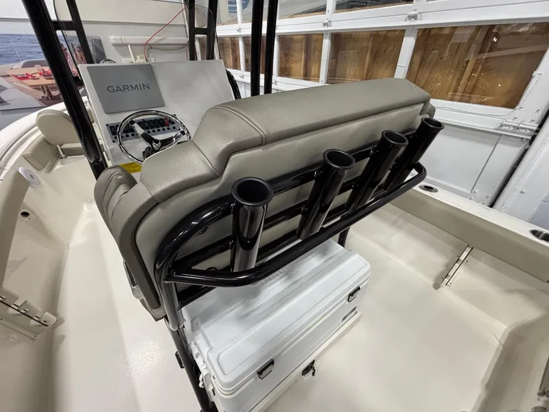 Slide: The Image of 2023 Key West 219 FS boat interior with Garmin console and rod holders. - 12