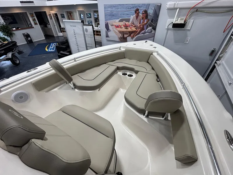 Slide: The Image of 2023 Key West 219 FS boat interior with beige seating and modern design. - 14