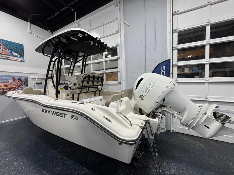 Slide: The Image of 2023 Key West 219 FS boat with Yamaha outboard motor in showroom. - 8