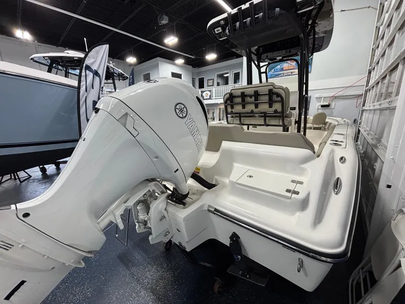 Slide: The Image of 2023 Key West 219 FS boat with Yamaha outboard motor in showroom. - 9