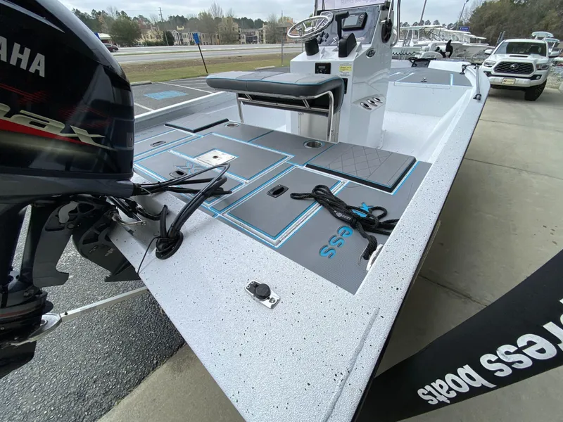 Slide: The Image of 2021 Xpress H190B boat with Yamaha engine, docked on a concrete surface. - 4