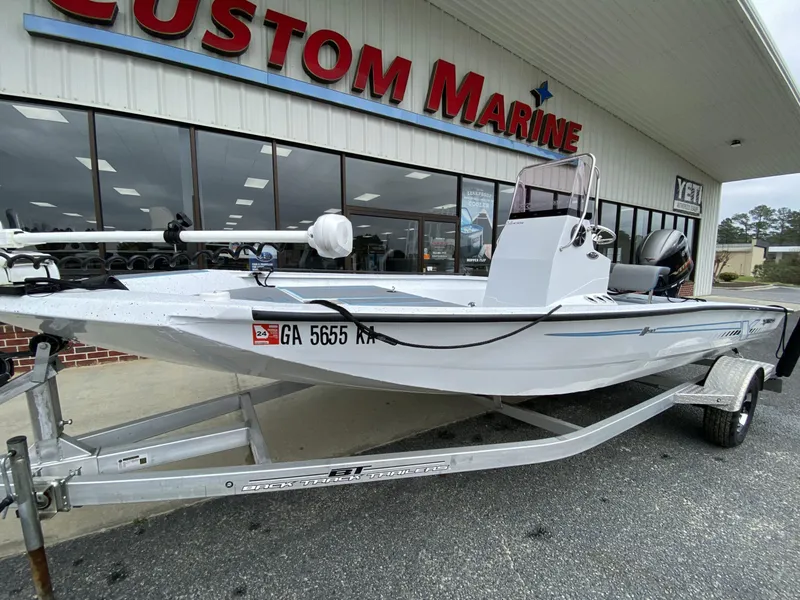 Slide: The Image of 2021 Xpress H190B boat on trailer outside Custom Marine store. - 7