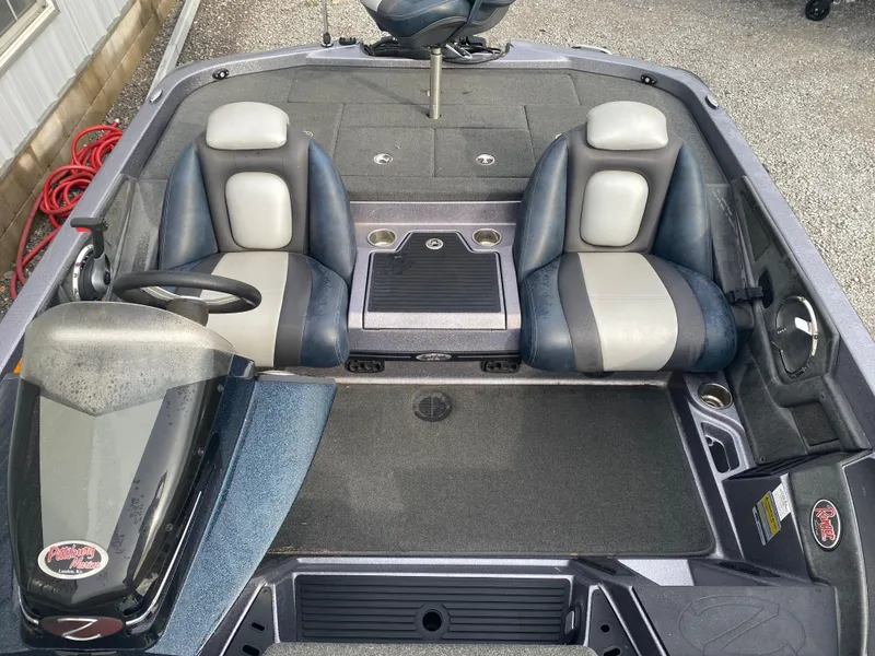 Slide: The Image of 2015 Ranger Z118 Comanche boat interior with dual seats and steering console. - 11