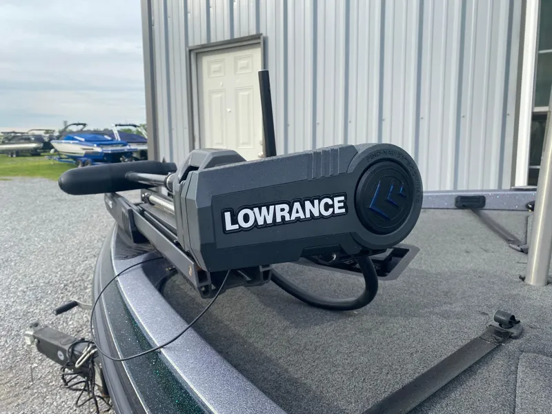 Slide: The Image of Lowrance equipment on 2015 Ranger Z118 Comanche boat near metal building. - 5