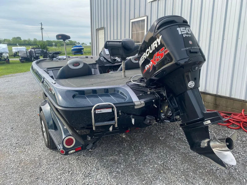 Slide: The Image of 2015 Ranger Z118 Comanche boat with Mercury 150 Pro XS engine, parked on gravel. - 7