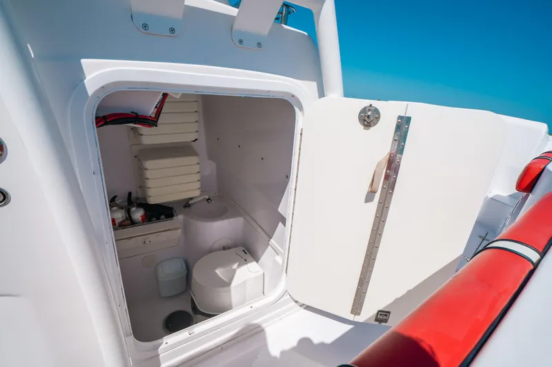 Slide: The Image of 2007 Donzi 38 ZF Cuddy boat interior with open storage compartment. - 14