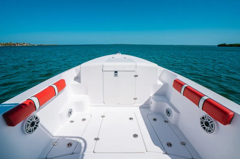 Slide: The Image of 2007 Donzi 38 ZF Cuddy boat interior with red accents on open water. - 7