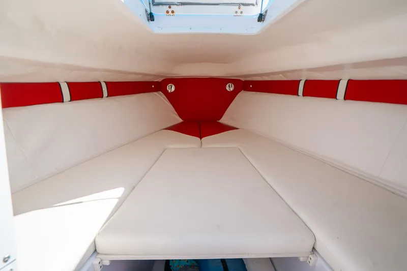 Slide: The Image of 2007 Donzi 38 ZF Cuddy interior with red and white cushioned seating. - 9