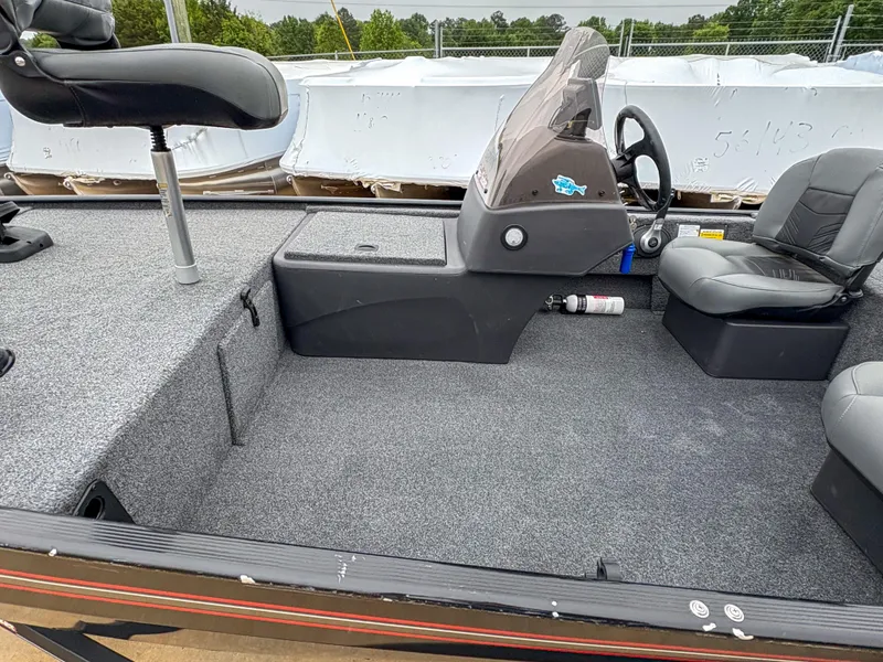 Slide: The Image of 2021 Tracker Bass Tracker Classic XL boat interior with seating and steering console. - 4