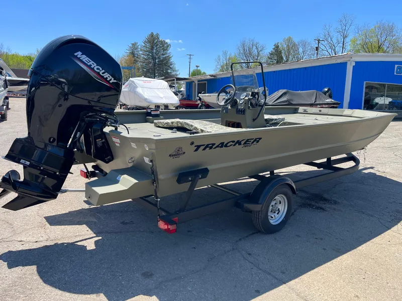 Slide: The Image of 2024 Tracker Grizzly 2072 CC boat with Mercury outboard motor on trailer. - 3