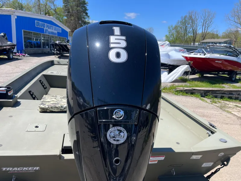 Slide: The Image of 2024 Tracker Grizzly 2072 CC boat with 150 HP engine in outdoor showroom. - 9