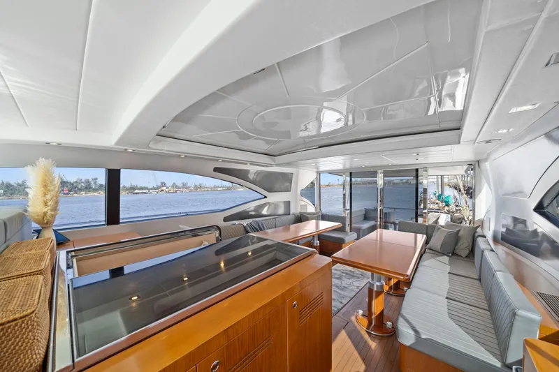 Slide: The Image of Mangusta 72 Express yacht docked by waterfront construction, clear sky, 2010 model. - 14