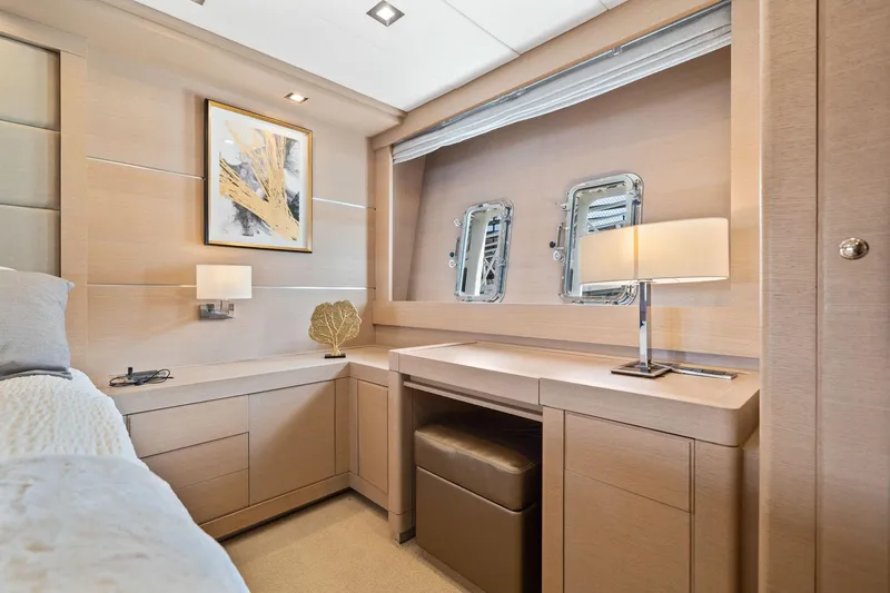 Slide: The Image of Interior of 2010 Mangusta 72 Express yacht with modern design and wooden cabinetry. - 23