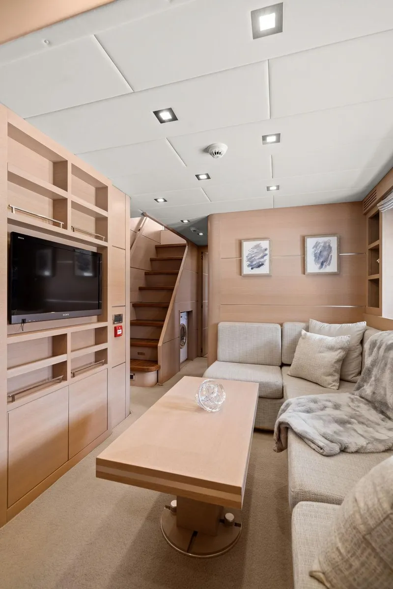 Slide: The Image of Shower area in 2010 Mangusta 72 Express yacht with wooden bench and modern fixtures. - 35