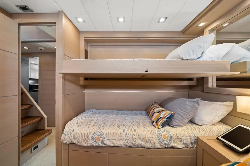 Slide: The Image of Luxurious interior of 2010 Mangusta 72 Express yacht with modern furnishings and built-in TV. - 39