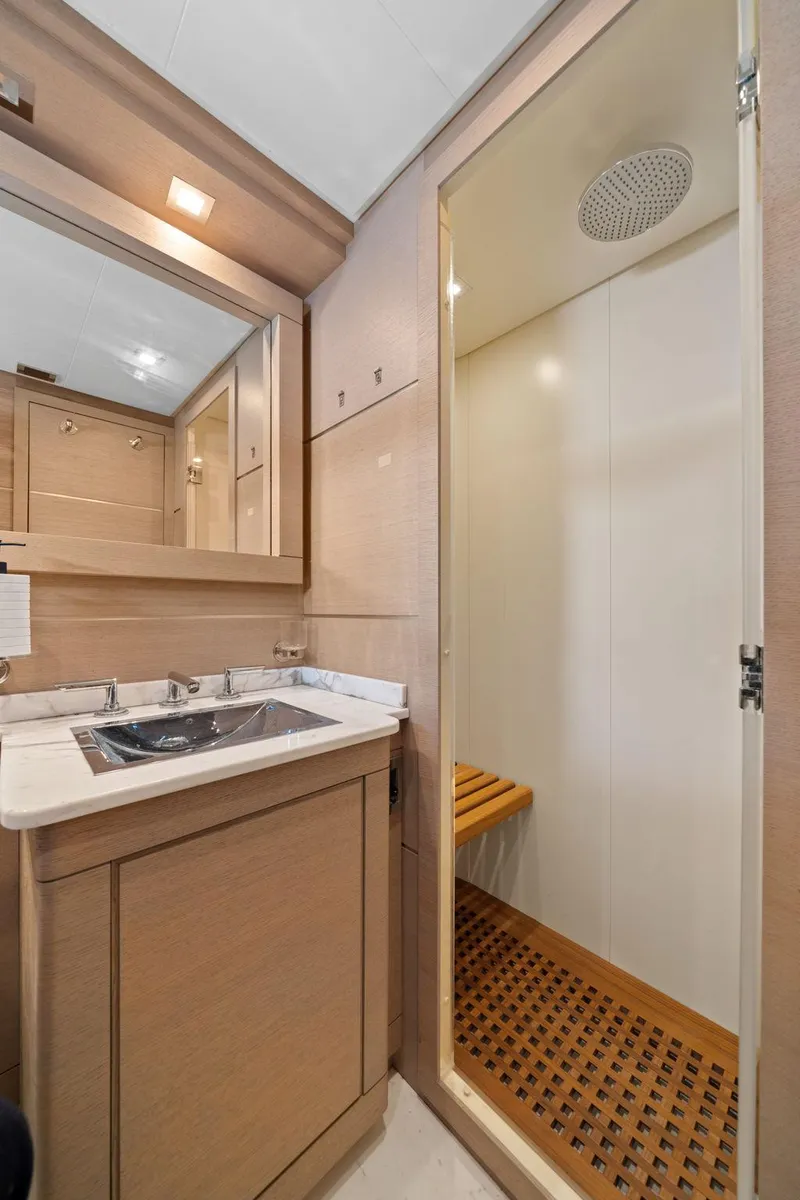 Slide: The Image of Luxurious bedroom interior of 2010 Mangusta 72 Express yacht with modern decor and cozy bedding. - 50