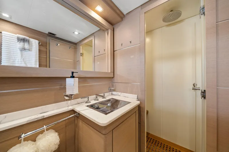 Slide: The Image of Luxurious bedroom interior of 2010 Mangusta 72 Express yacht with modern decor and ambient lighting. - 51