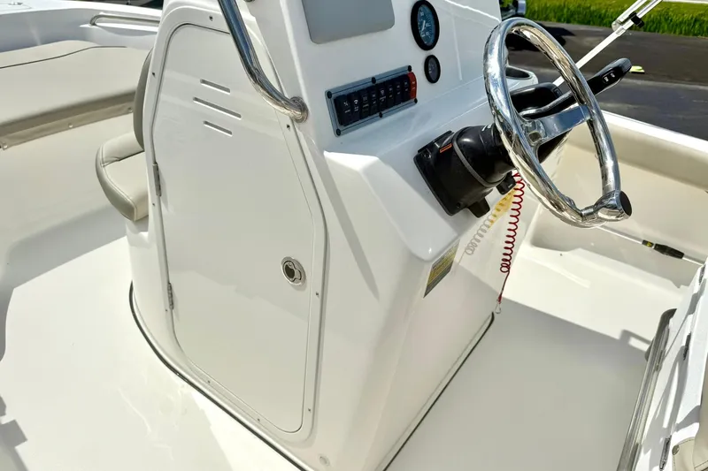 Slide: The Image of 2023 Key West 189 FS boat console with steering wheel and control panel. - 19