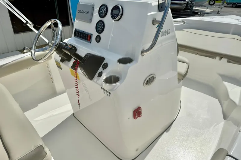 Slide: The Image of 2023 Key West 189 FS boat console with steering wheel and gauges. - 21