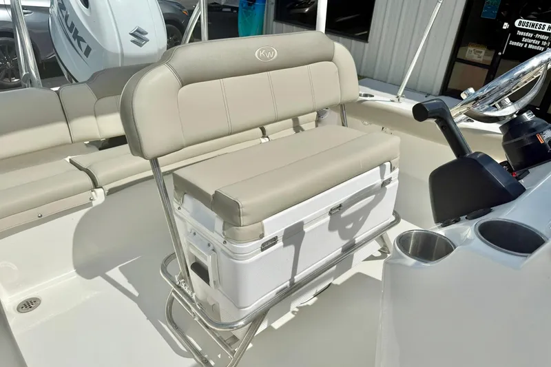 Slide: The Image of 2023 Key West 189 FS boat interior with cushioned seating and console. - 25