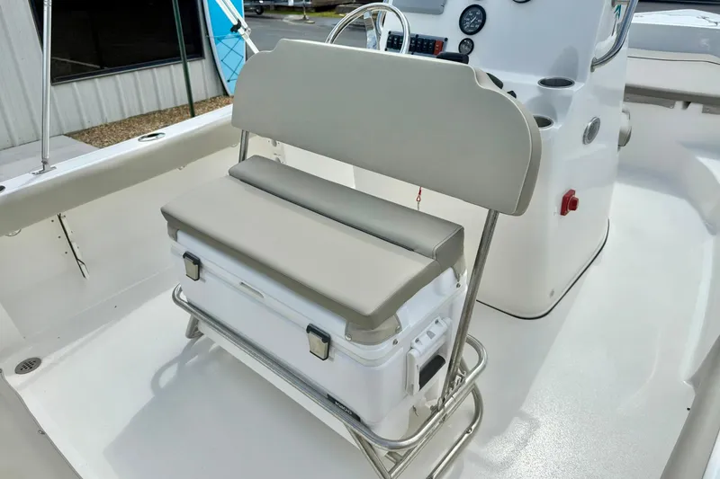Slide: The Image of 2023 Key West 189 FS boat interior with cushioned seating and storage. - 26