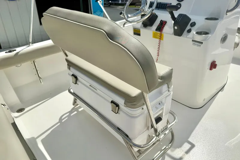 Slide: The Image of 2023 Key West 189 FS boat interior with cushioned seating and console. - 28