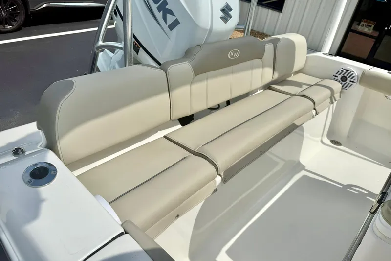 Slide: The Image of 2023 Key West 189 FS boat with beige seating and Suzuki engine. - 29