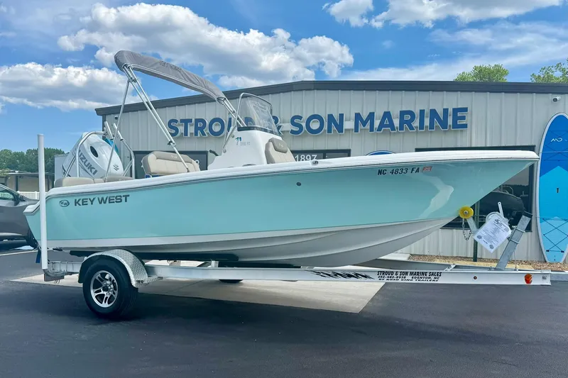 Slide: The Image of 2023 Key West 189 FS boat on trailer at Strong's Marine dealership. - 3