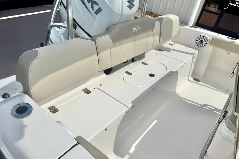 Slide: The Image of 2023 Key West 189 FS boat interior with cushioned seating and storage compartments. - 30