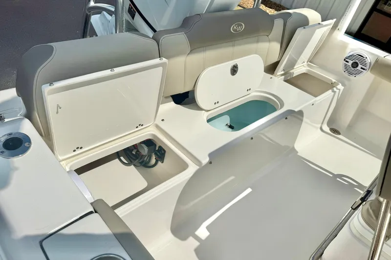 Slide: The Image of 2023 Key West 189 FS boat interior with open storage compartments and seating. - 31