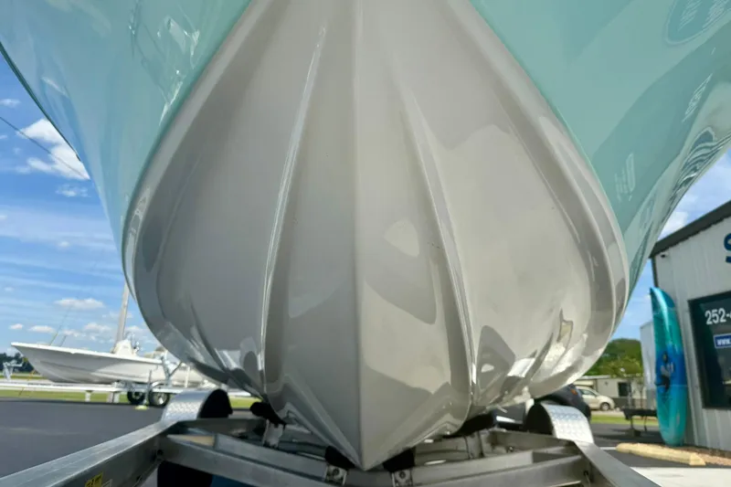 Slide: The Image of 2023 Key West 189 FS boat hull on trailer, showcasing sleek design. - 8