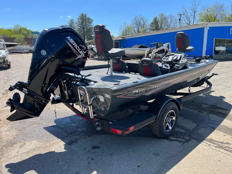 Slide: The Image of 2024 Ranger RT188C boat with Mercury engine, parked outdoors on a sunny day. - 3