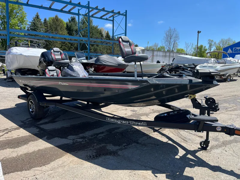 Slide: The Image of 2024 Ranger RT188C fishing boat on trailer, parked outdoors. - 4