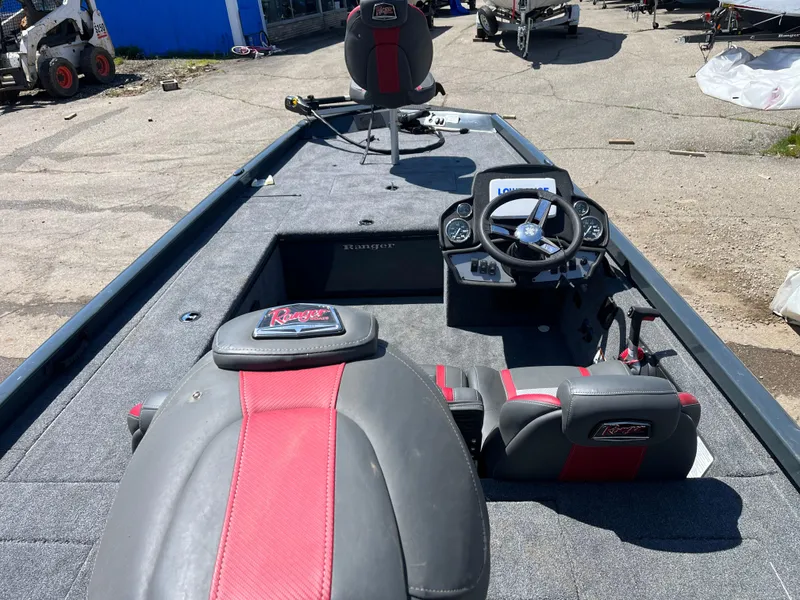 Slide: The Image of 2024 Ranger RT188C fishing boat interior with steering console and seating. - 5