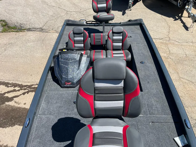 Slide: The Image of 2024 Ranger RT188C boat interior with red and gray seating, viewed from above. - 6