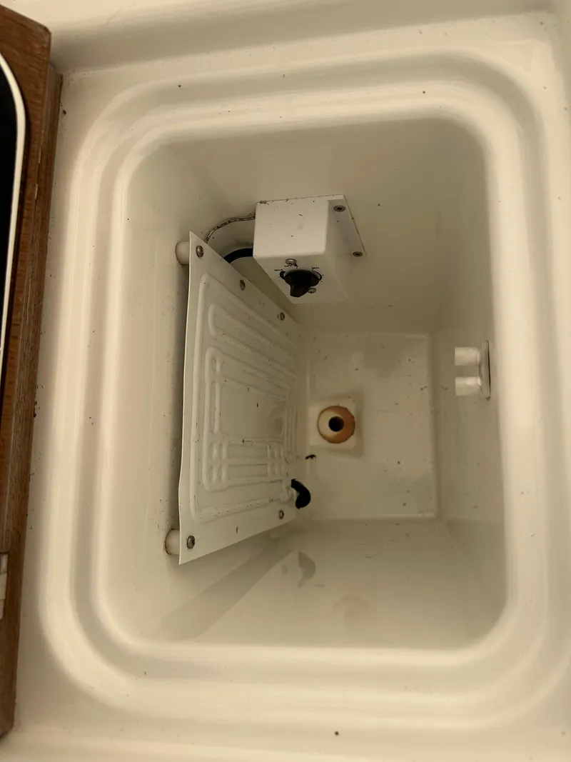 Slide: The Image of Beneteau Oceanis 51.1 2020 yacht interior compartment with white panel and wiring. - 11