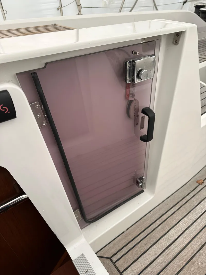 Slide: The Image of Beneteau Oceanis 51.1 yacht hatch door, 2020 model, with sleek design and secure handle. - 12