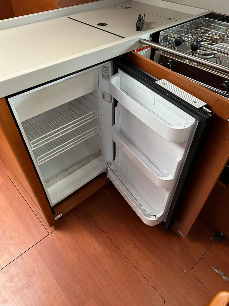 Slide: The Image of Compact refrigerator in 2020 Beneteau Oceanis 51.1 yacht kitchen interior. - 20