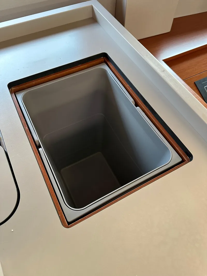 Slide: The Image of Built-in waste bin on 2020 Beneteau Oceanis 51.1 yacht kitchen counter. - 22