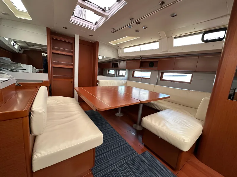 Slide: The Image of Luxurious interior of 2020 Beneteau Oceanis 51.1 yacht with elegant wood finish and seating. - 23