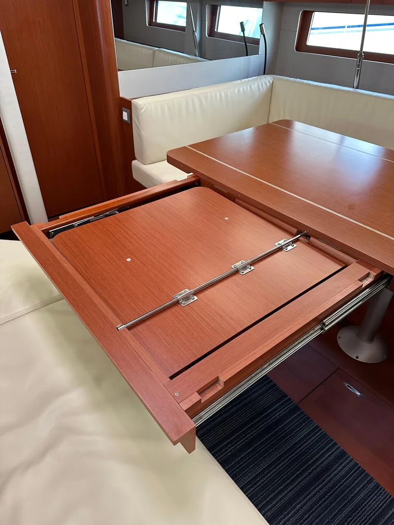 Slide: The Image of Interior of 2020 Beneteau Oceanis 51.1 yacht with foldable wooden table. - 26