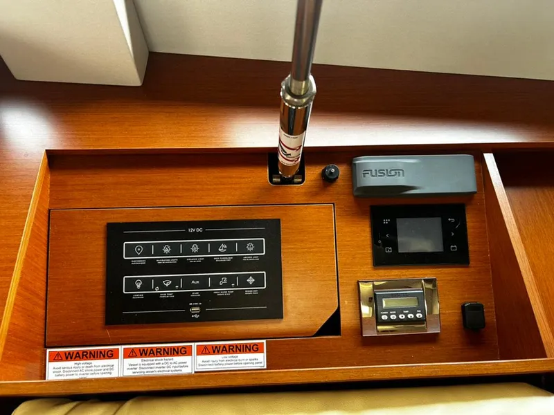 Slide: The Image of Control panel of a 2020 Beneteau Oceanis 51.1 yacht with digital displays and warning labels. - 29