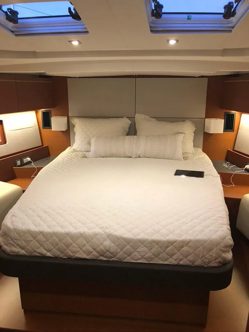 Slide: The Image of Luxurious bedroom interior of 2020 Beneteau Oceanis 51.1 yacht with skylights. - 32