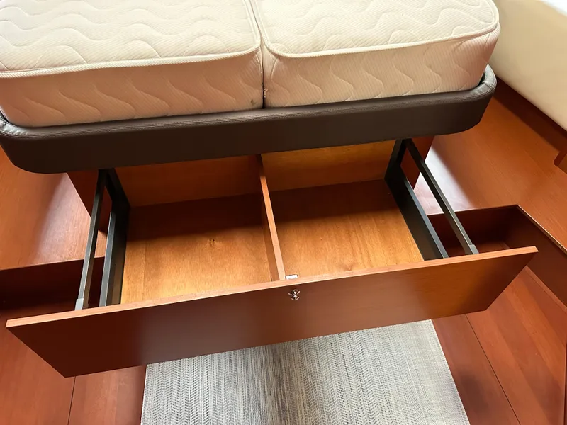 Slide: The Image of Under-bed storage drawer in a 2020 Beneteau Oceanis 51.1 yacht cabin. - 33
