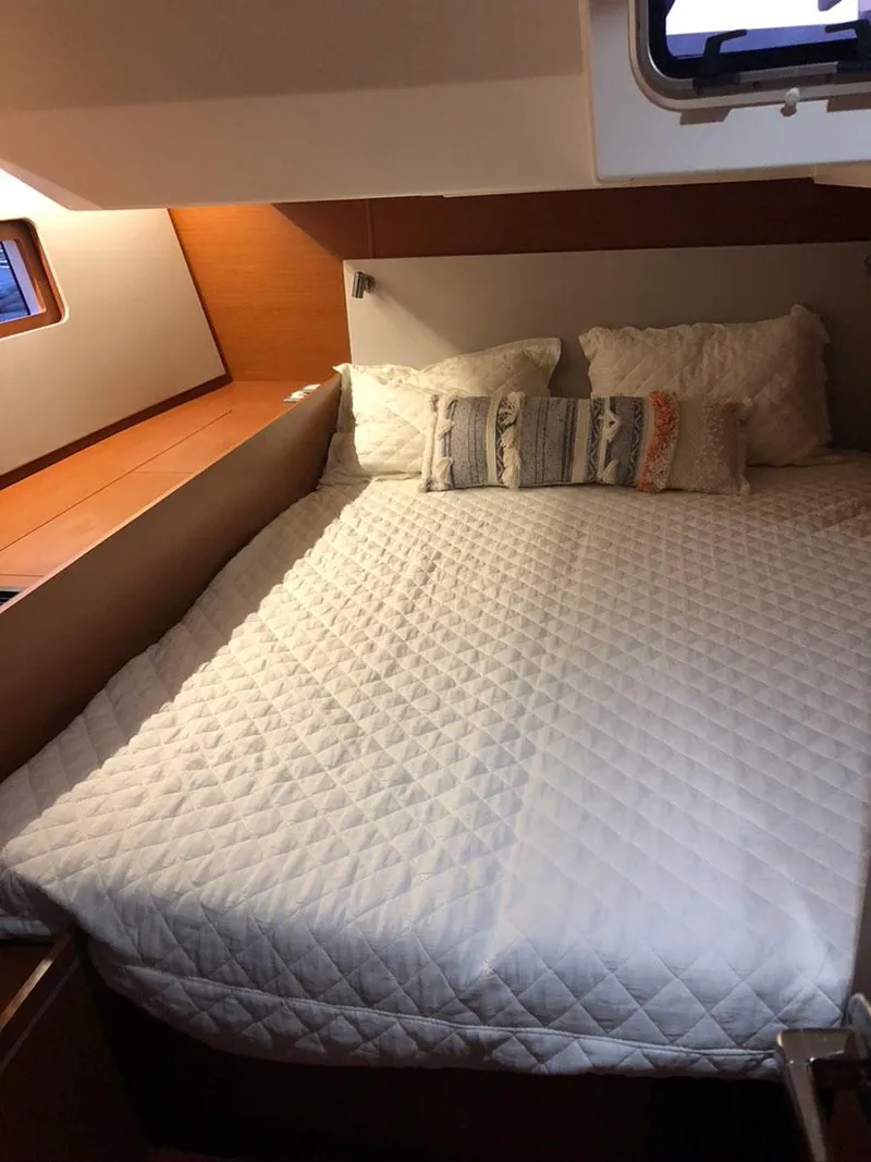 Slide: The Image of 2020 Beneteau Oceanis 51.1 cabin with cozy bed and pillows. - 38