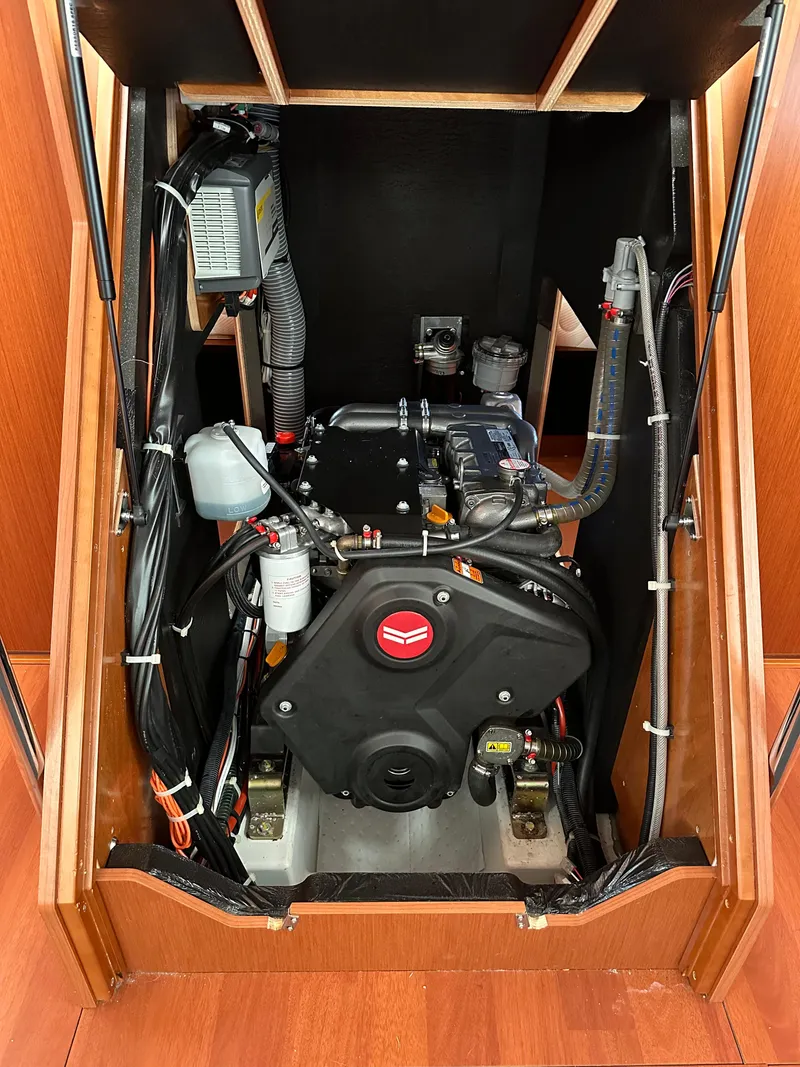 Slide: The Image of Engine compartment of a 2020 Beneteau Oceanis 51.1 sailboat, showcasing mechanical components. - 42