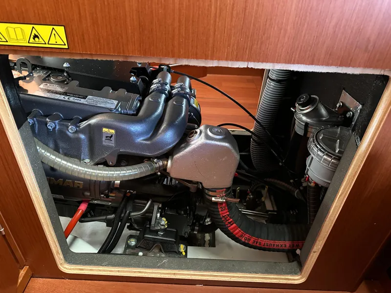 Slide: The Image of Engine compartment of a 2020 Beneteau Oceanis 51.1 sailboat, showcasing mechanical components. - 43