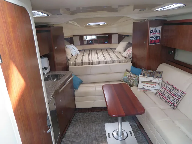 Slide: The Image of Interior of 2013 Monterey 340 Sport Yacht with cozy seating and modern amenities. - 10