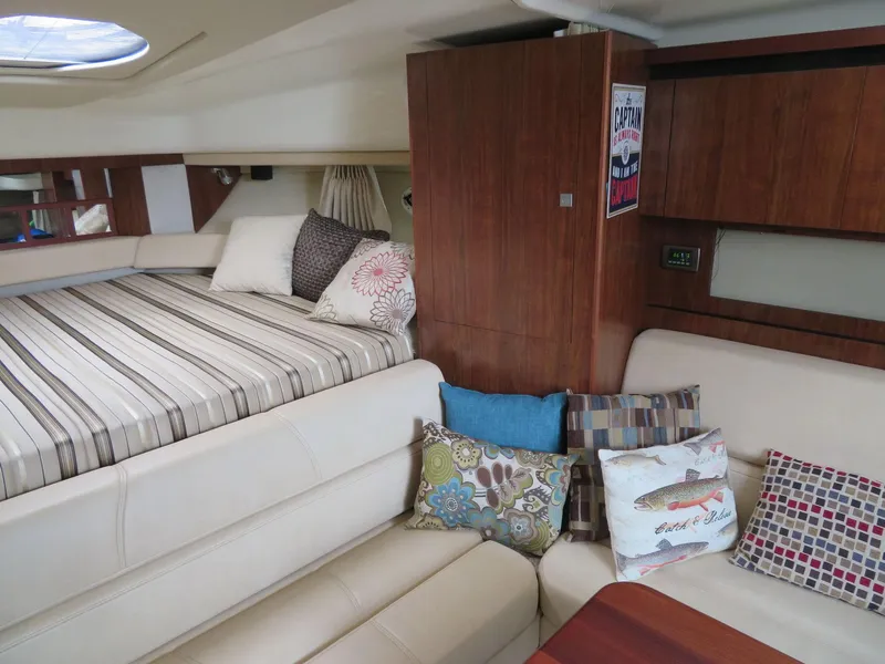 Slide: The Image of Interior of 2013 Monterey 340 Sport Yacht with cozy seating and stylish decor. - 13