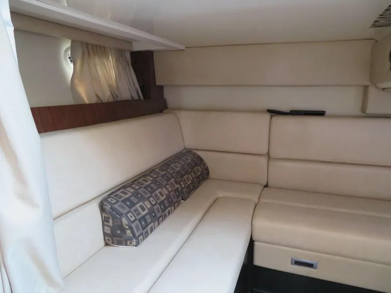 Slide: The Image of Interior of 2013 Monterey 340 Sport Yacht with beige seating and patterned cushion. - 15